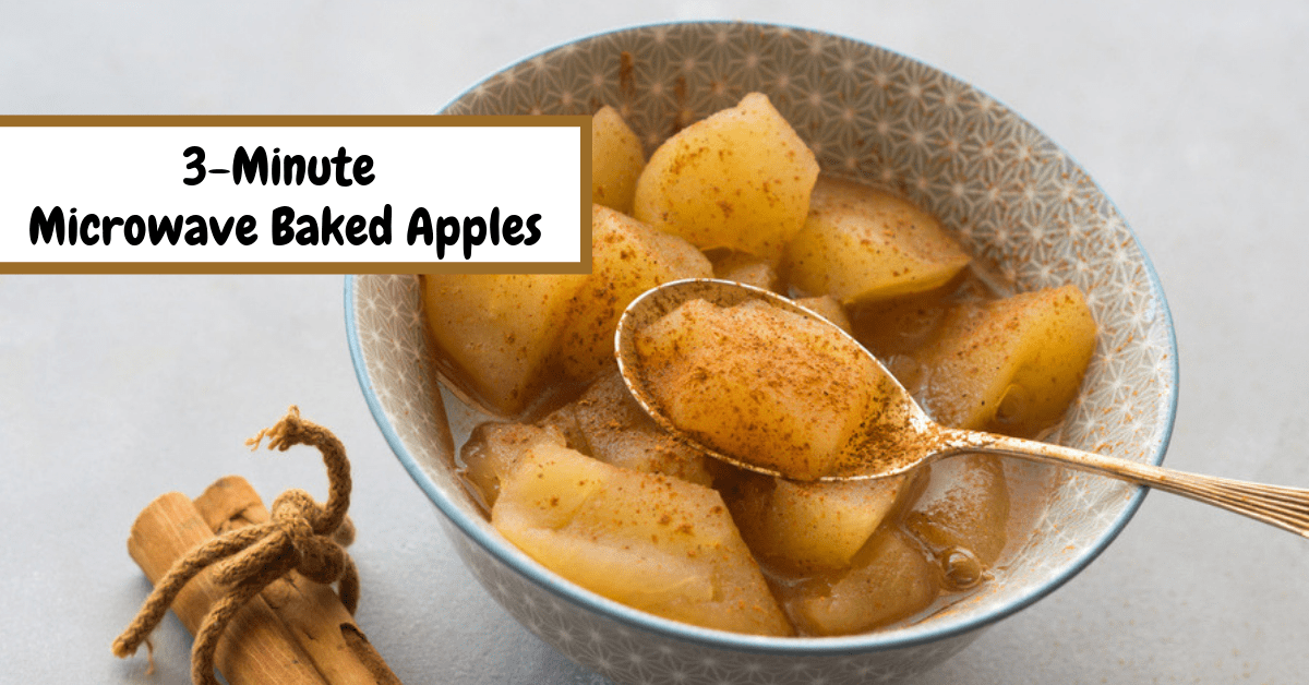 Baked apples soaked with syrup and sprinkled with cinnamon powder on a  bowl. 