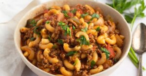 Bowl of American Goulash with Diced Tomato Sauce, Herbs, Ground Beef and Elbow Pasta