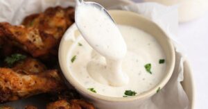 Homemade Creamy Wingstop Ranch Sauce with Chicken Wings and Herbs