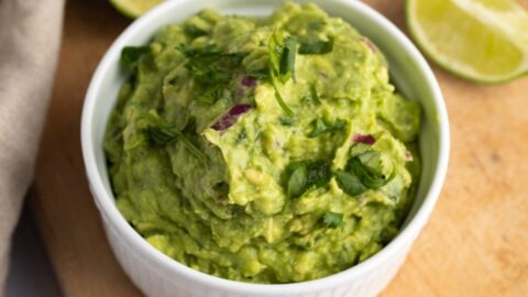 Appetizing Homemade Chipotle Guacamole in a Ramekin with Lime