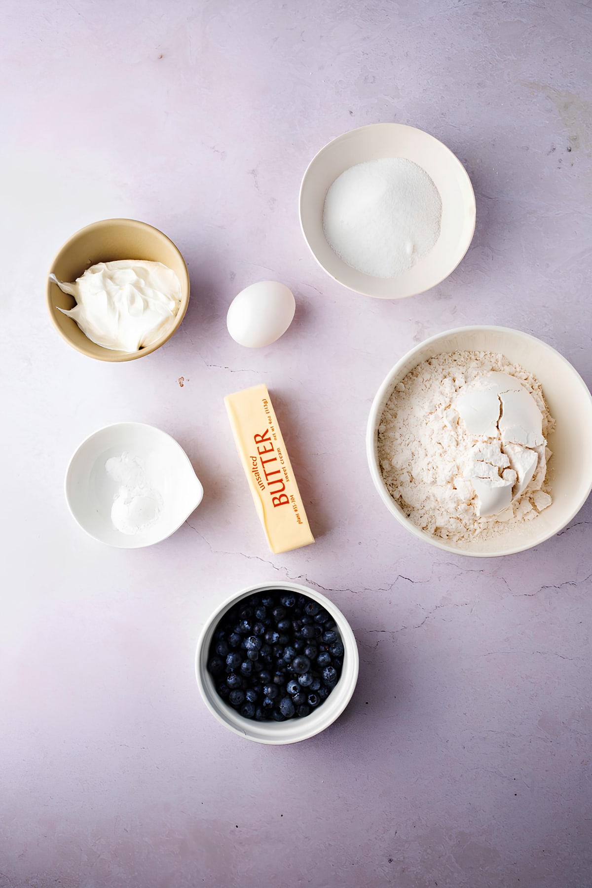 Homemade Scone Ingredients: Flour, Unsalted Butter, White Sugar, Baking Powder, Soda, Salt, Eggs, Sour Cream and Blueberries