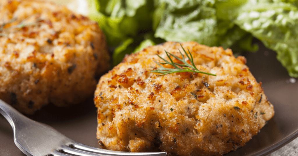 Tender Crab Cakes served on a Plate with Dill
