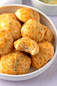 Bowl of Homemade Red Lobster Cheddar Bay Biscuits with Garlic