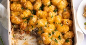 Comforting Tater Tot Casserole Packed with Ground Beef, Herbs and Cheese