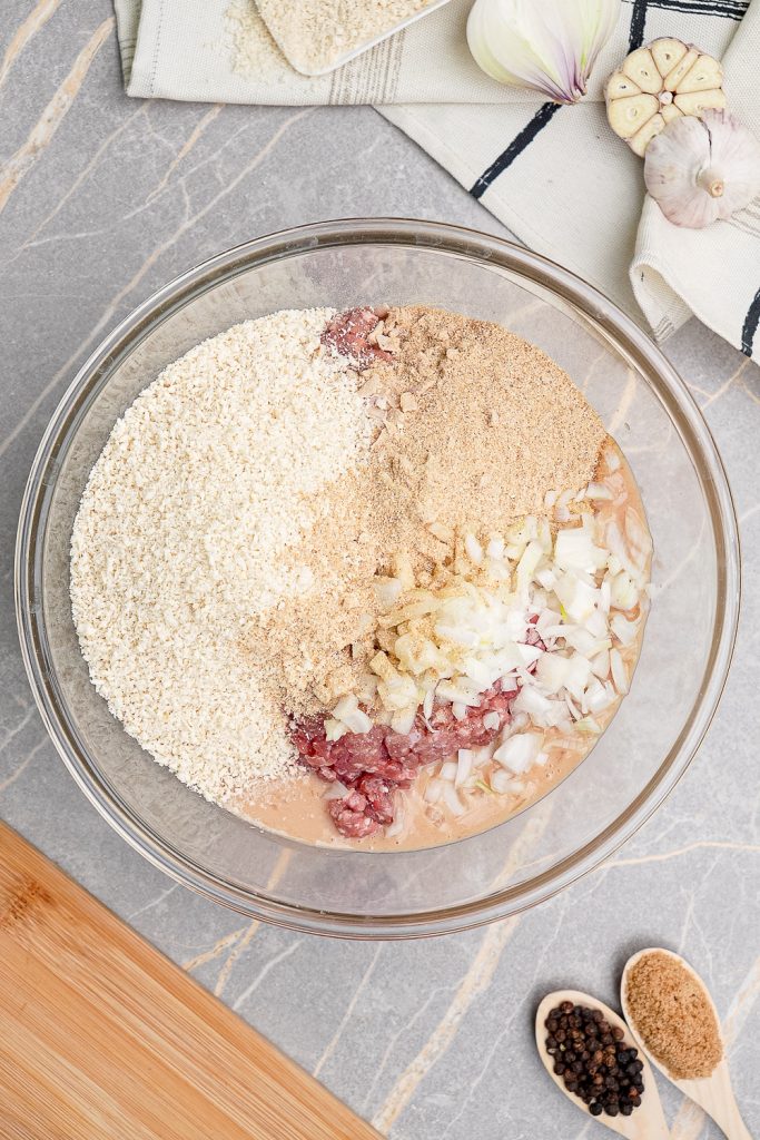 Meatloaf Ingredients in a Glass Mixing Bowl