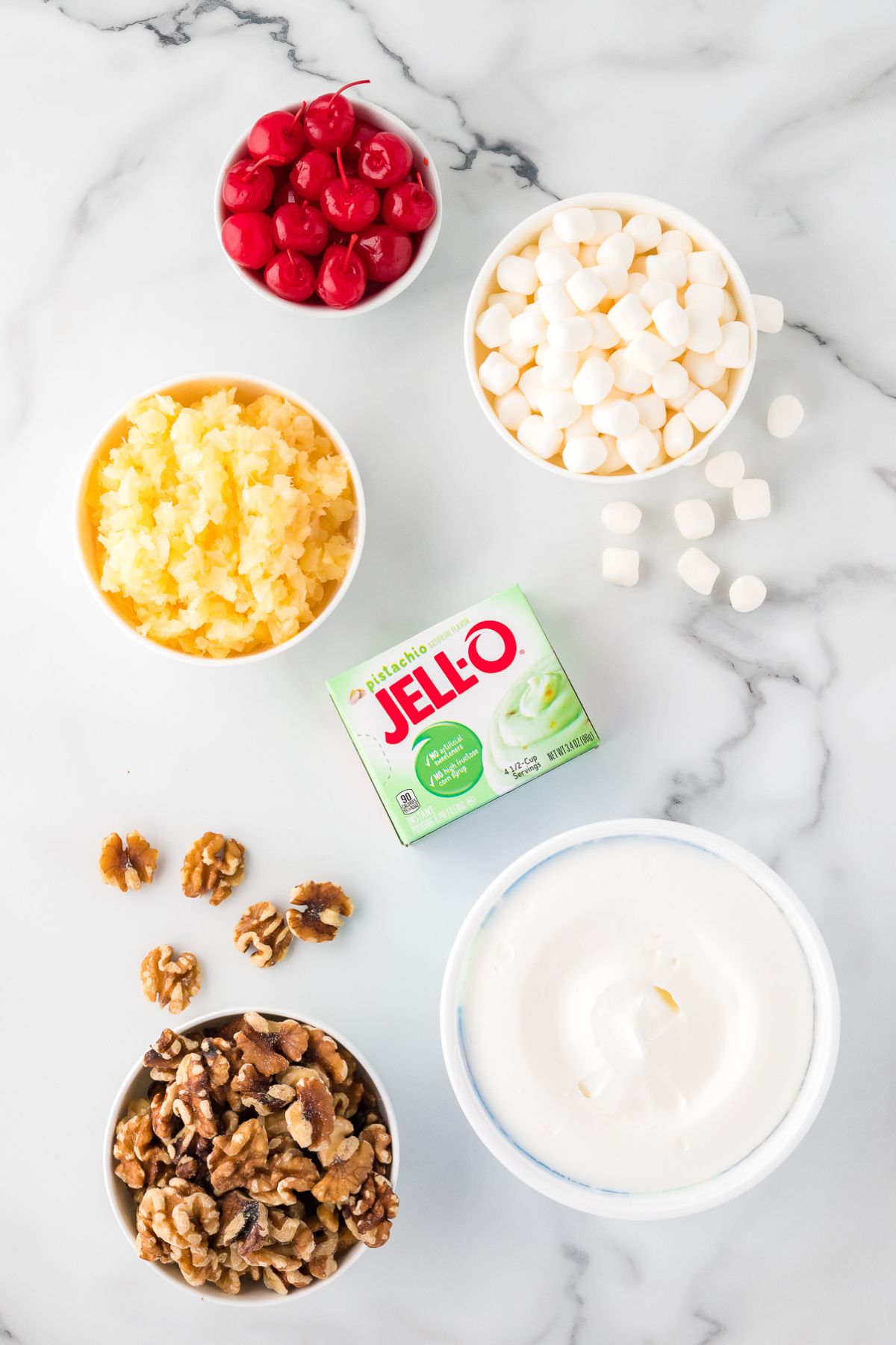 Jello, cherries, minced pineapple chunks and chopped walnuts.