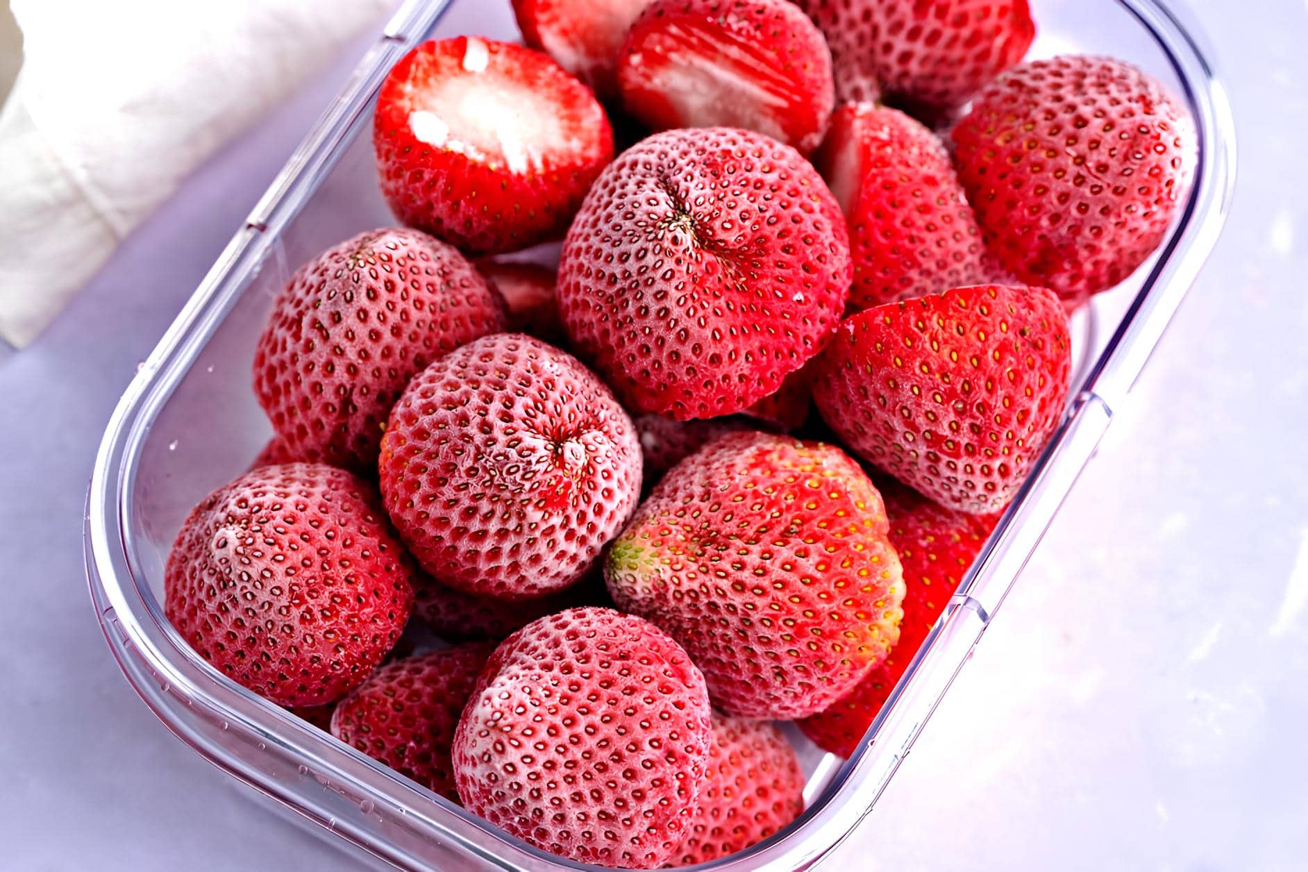 Frozen Strawberries in a Plastic Container