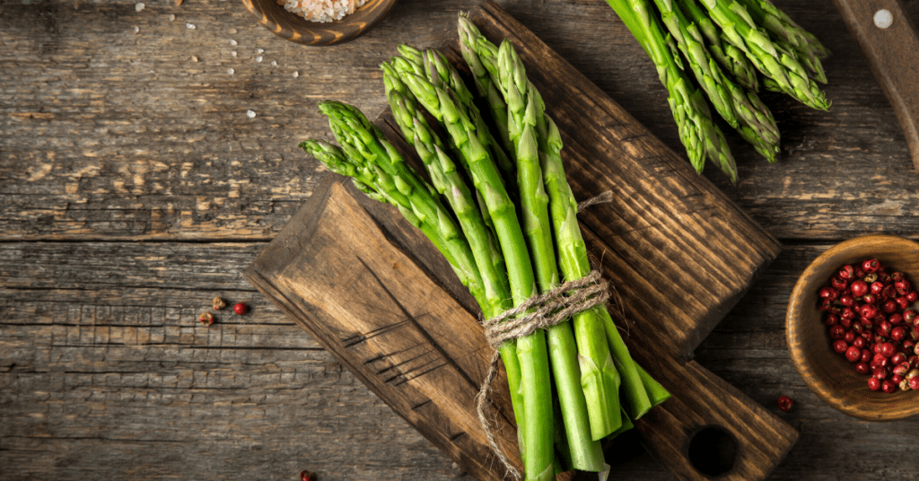 Bunch of Asparagus Stalks on a Chopping Board