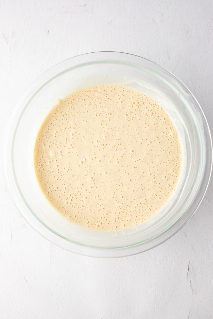 Waffle batter in a glass bowl.