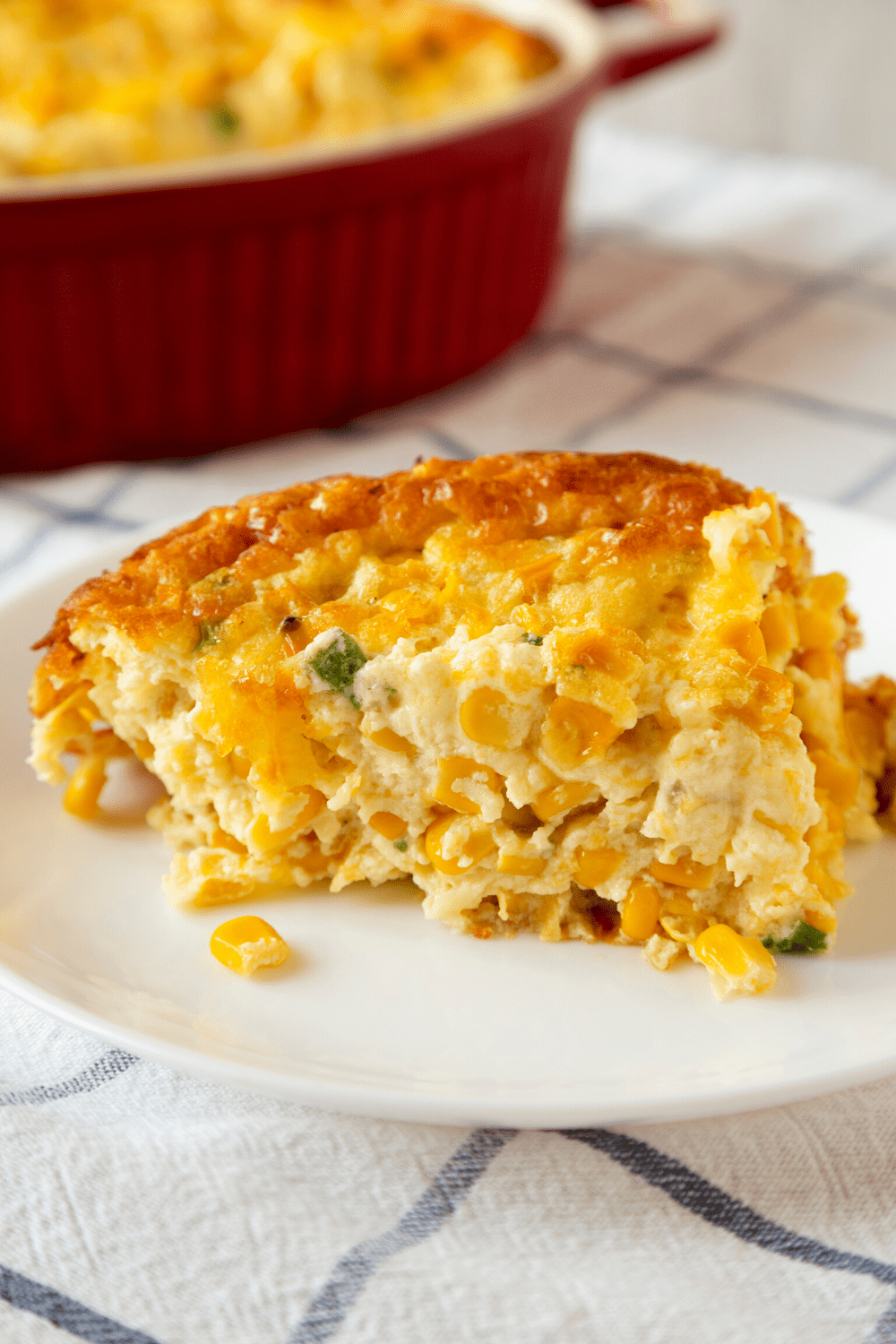 Slice of Cheddar and Corn Pudding on a plate