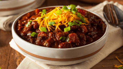 Chili Con Carne with Cheese and Chopped Onions