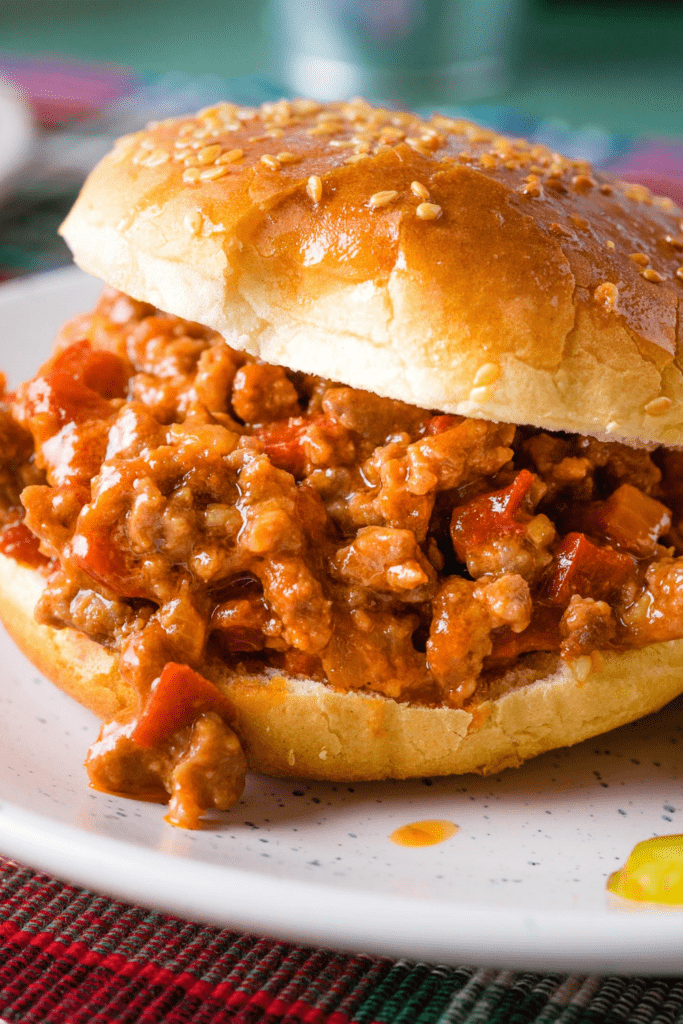 Sloppy Joe served on a white plate. Made with a sweet and zesty sauce. 