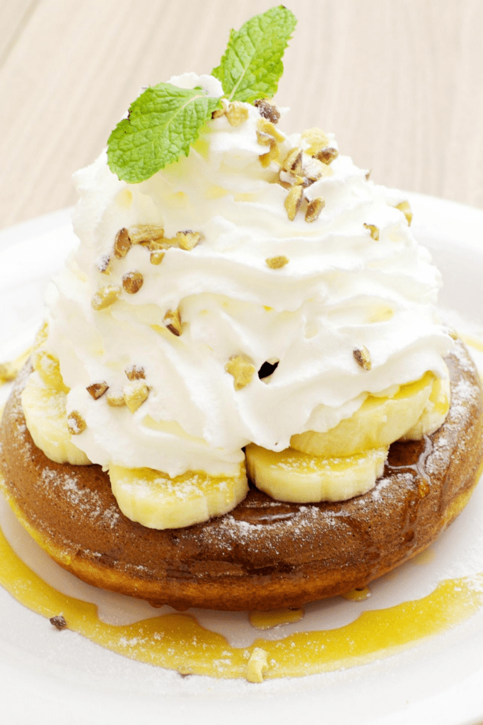 Pancakes with Whipped Cream, Bananas and Syrup