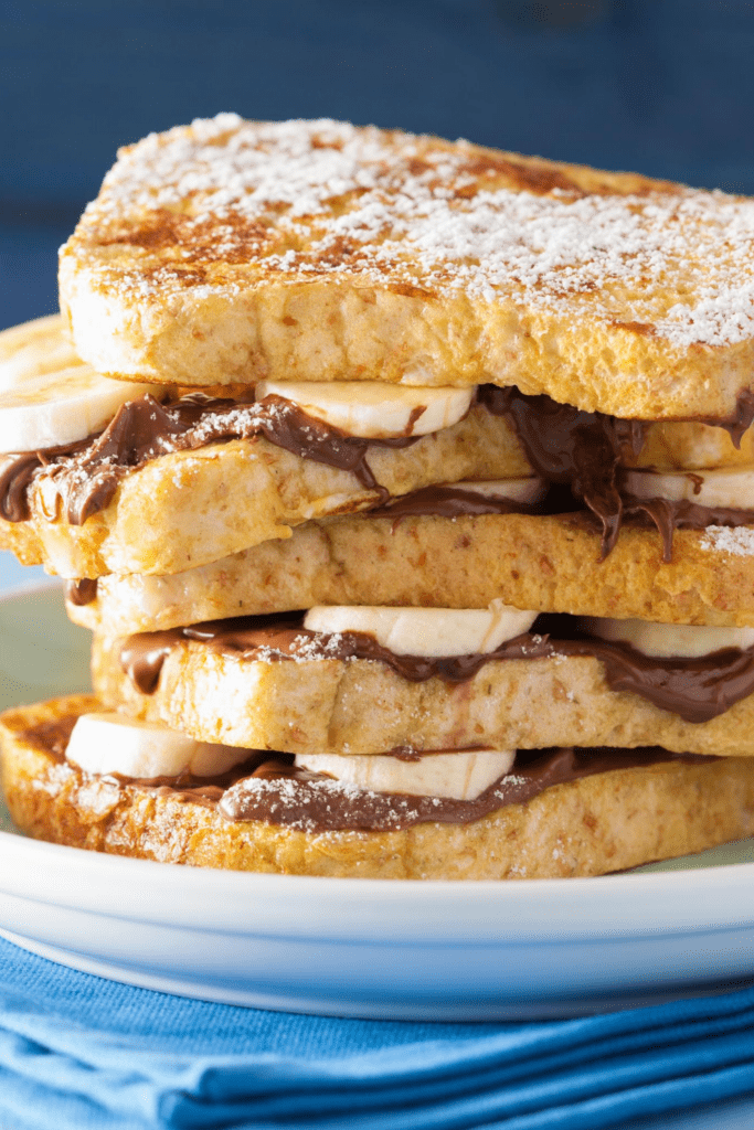 French Toast with Powdered Sugar, Banana and Peanut Butter