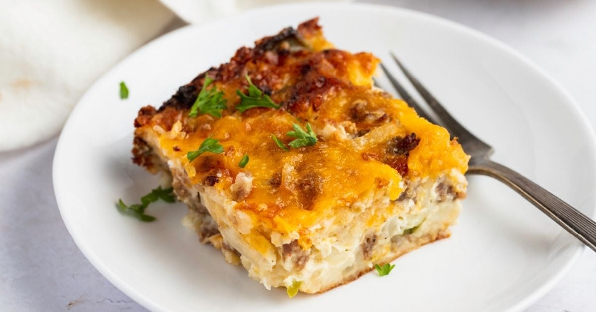 Slice of Homemade Breakfast Casserole with Cheese, Pork Sausage and Vegetables