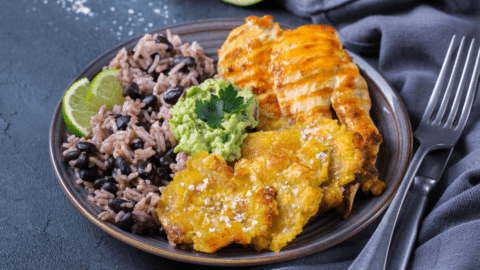 Caribbean Food: Rice with Black Beans, Fried Plantains, Chicken and Guacamole