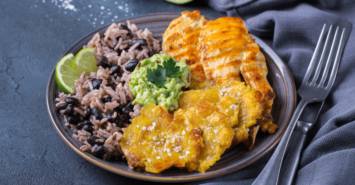 Caribbean Food: Rice with Black Beans, Fried Plantains, Chicken and Guacamole