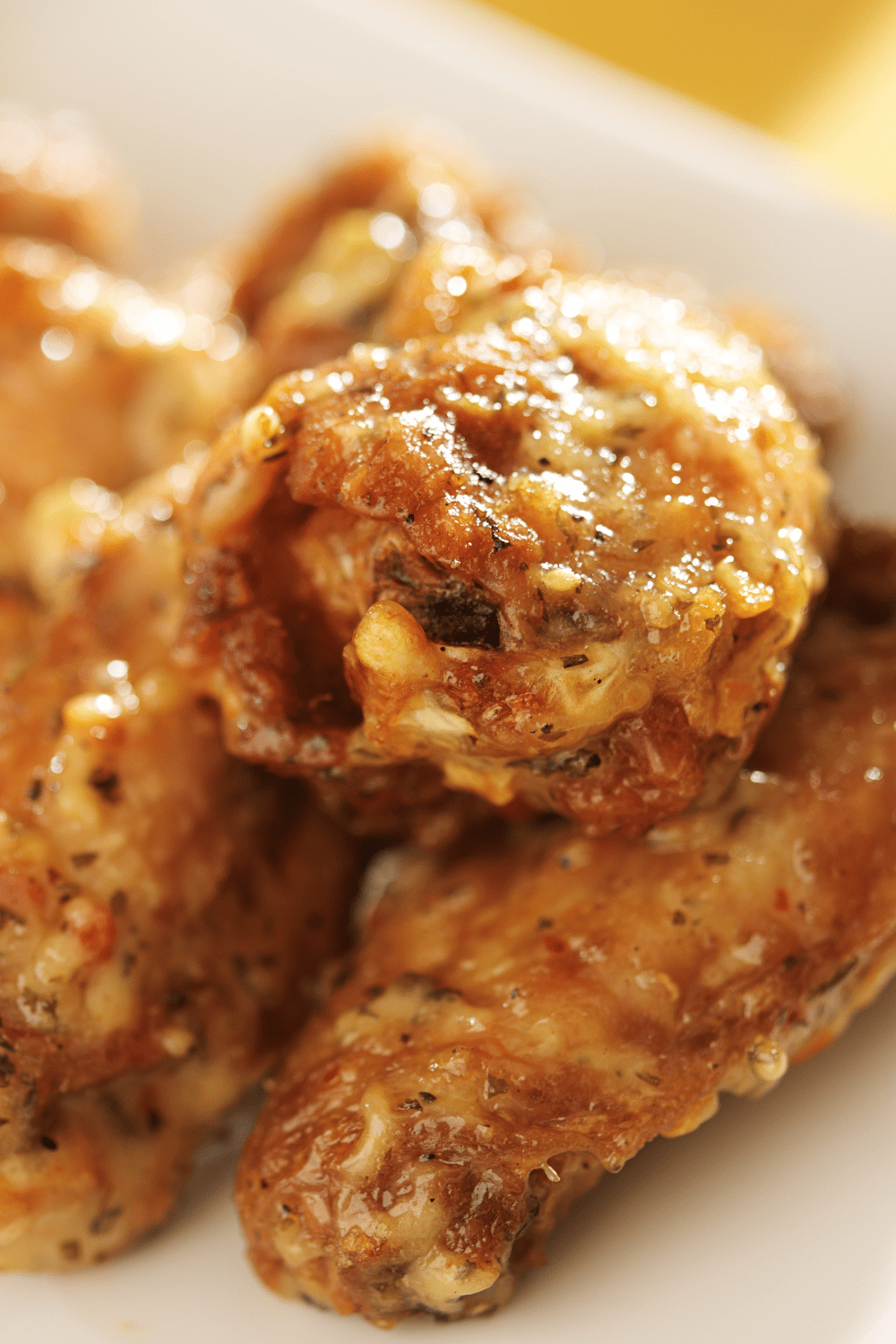 Closeup of garlic parmesan chicken wings. 