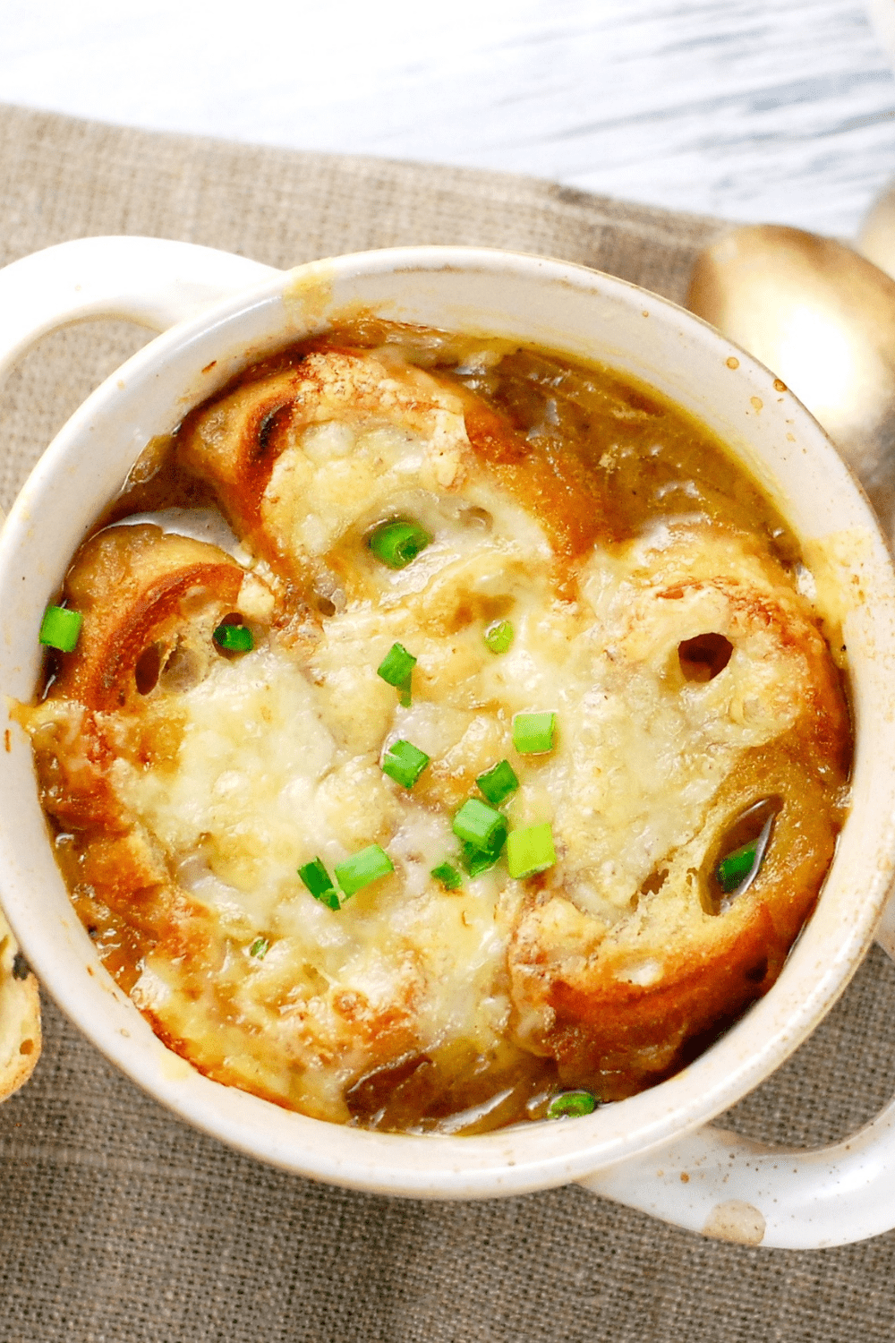 French onion soup in a small pot.