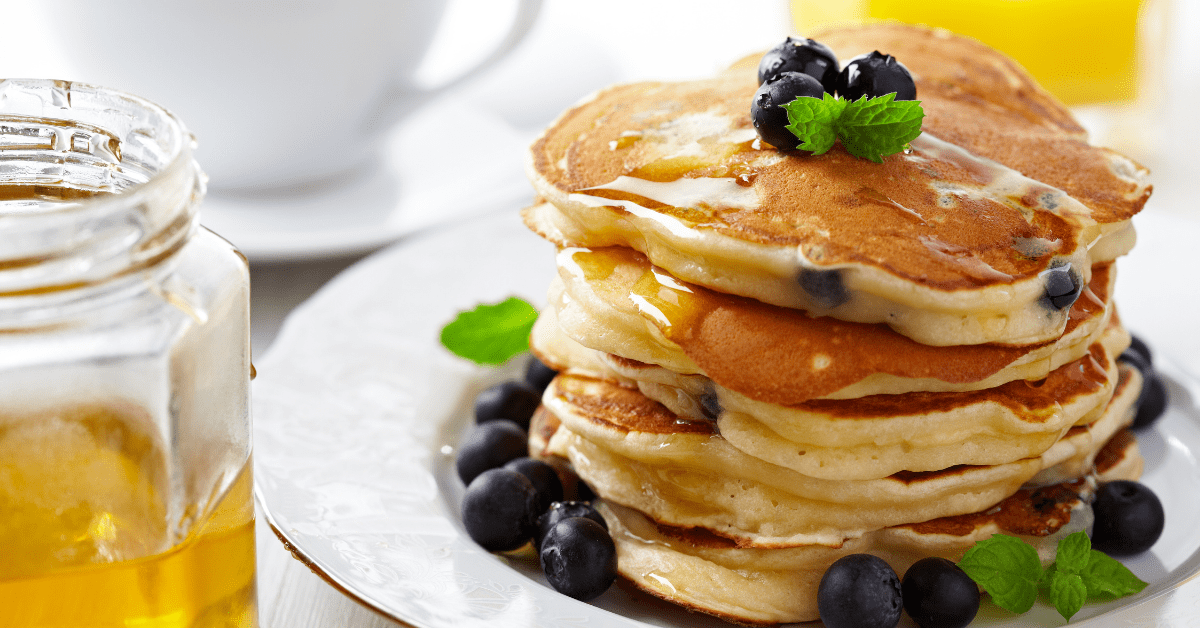 Stacks of Blueberry Pancakes with Maple Syrup