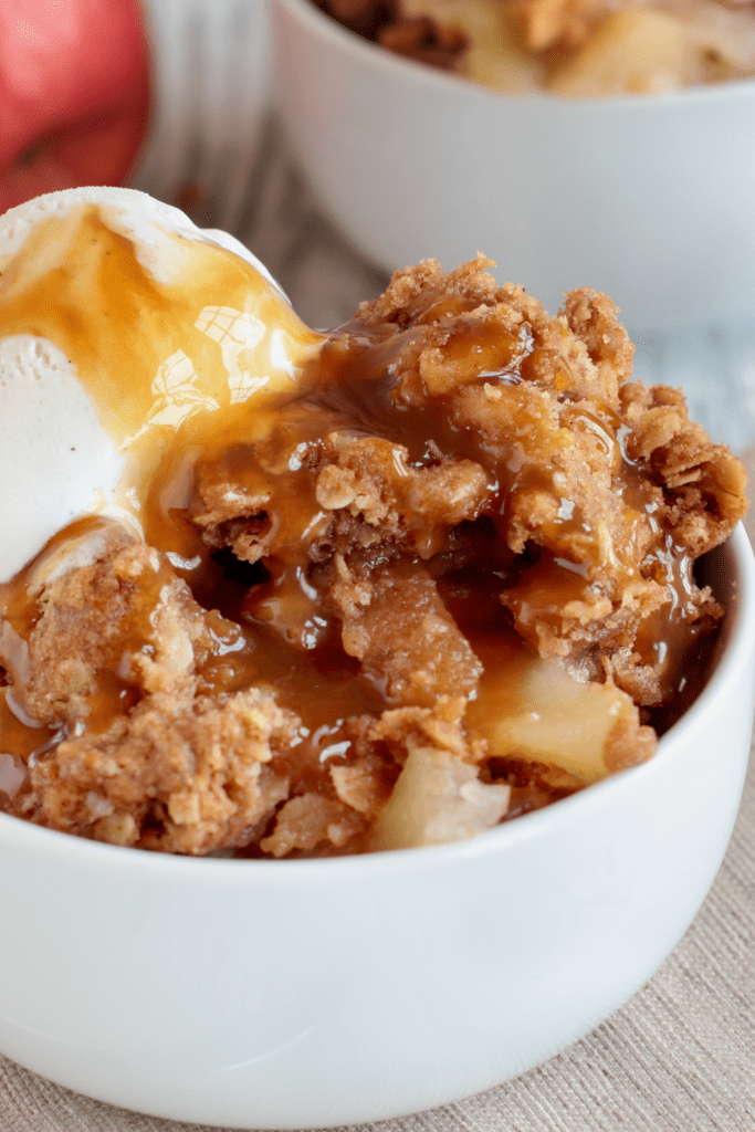 Bowl of Apple Crisp with Ice Cream and Caramel Sauce