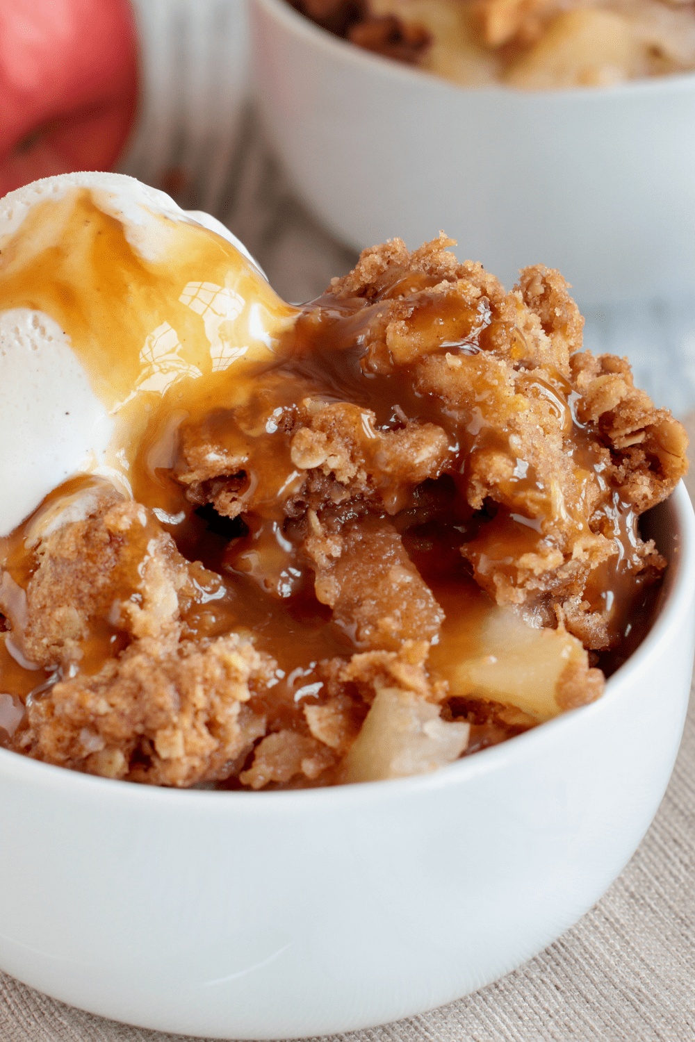 Bowl of Apple Crisp with Ice Cream and Caramel Syrup