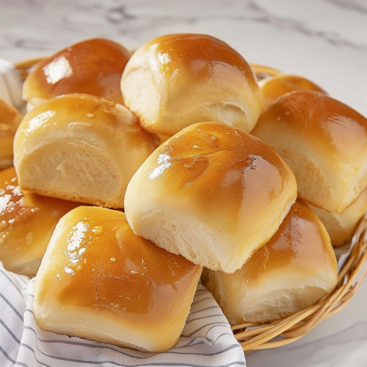 Copycat Texas Roadhouse Rolls in a Basket With Cloth Lining.
