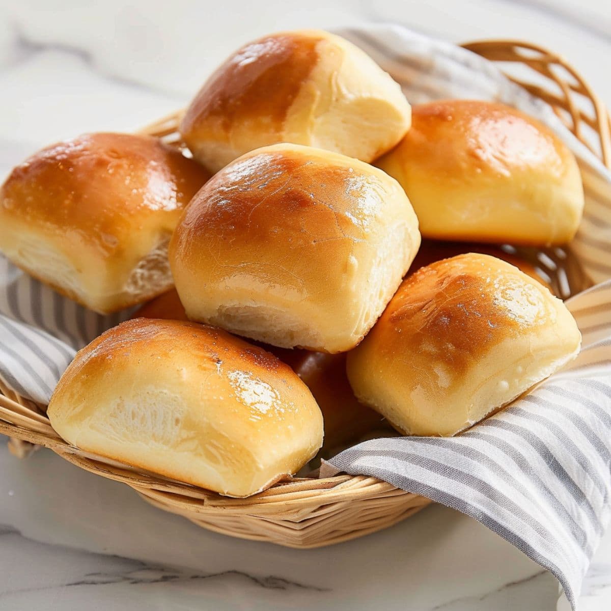 Buttery Texas Roadhouse rolls served in a woven basket.