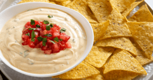 Homemade Queso Dip with Tomatoes and Tortilla Chips