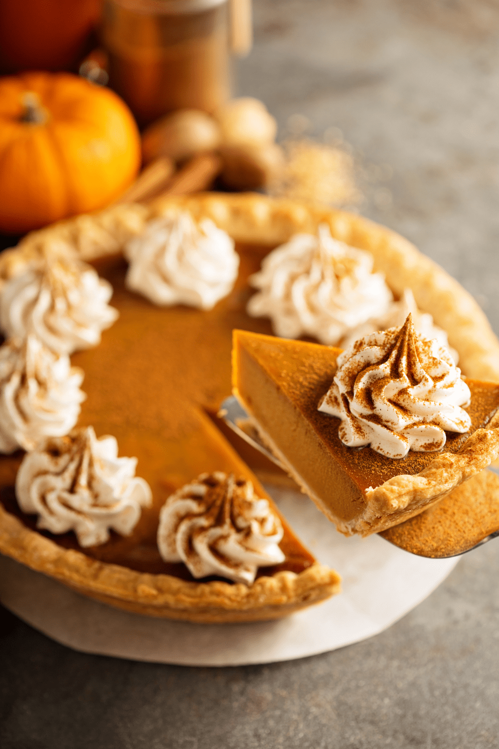 Pumpkin Pie With Whipped Cream And Cinnamon