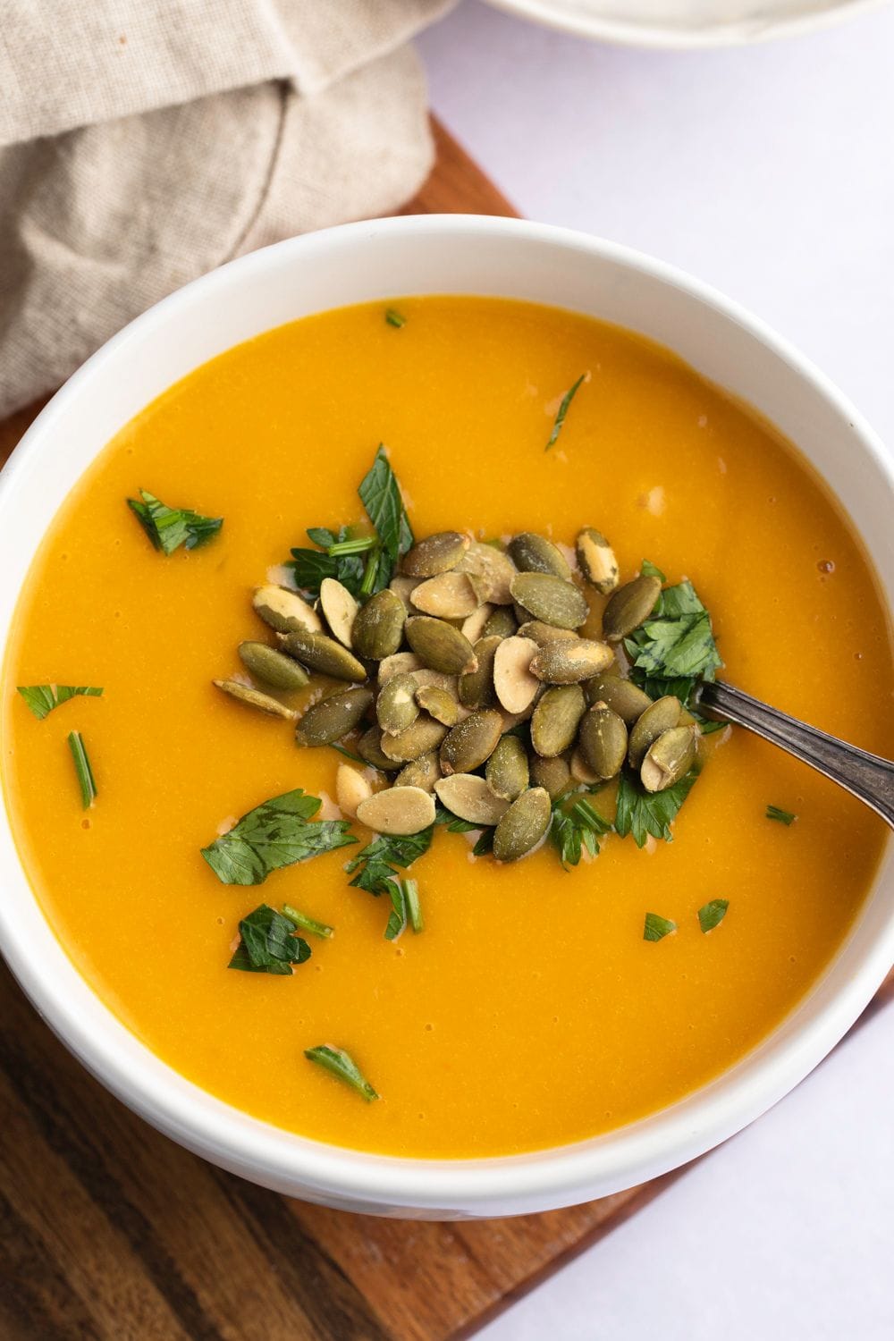 Butternut Squash Soup with Seeds and Herbs, top view