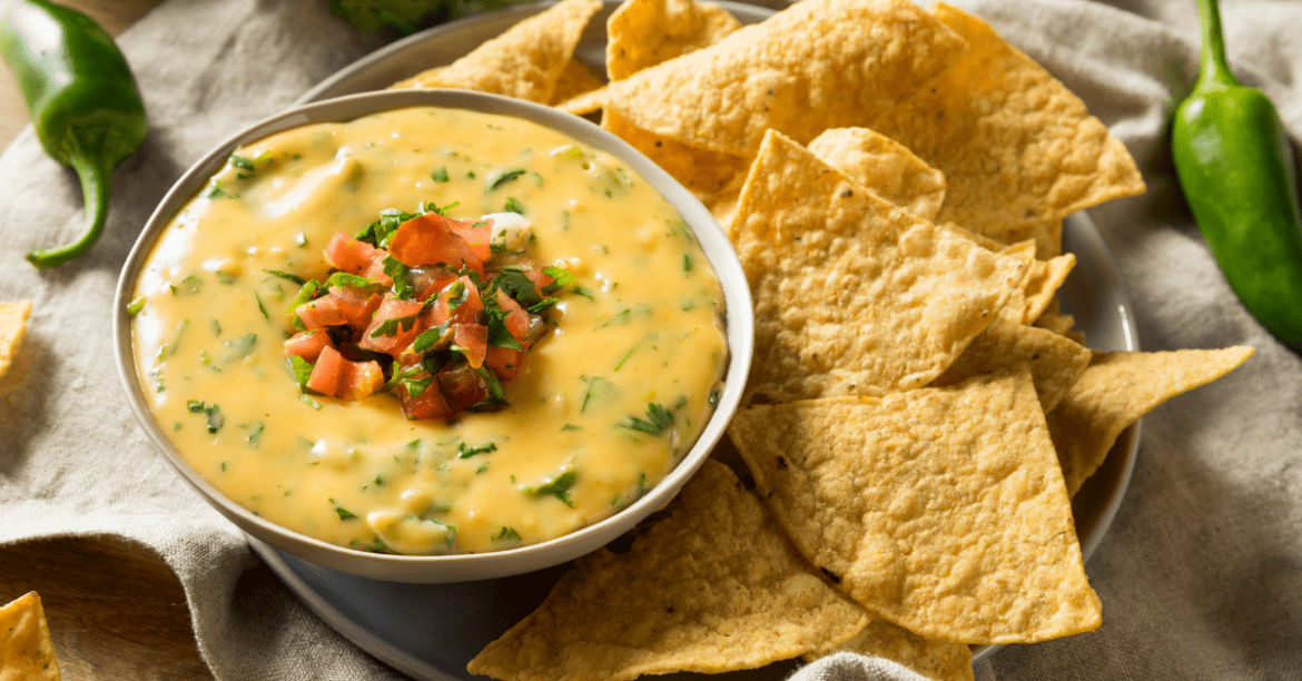 Queso Dip With Chopped Tomatoes And Tortilla Chips 1170x612 