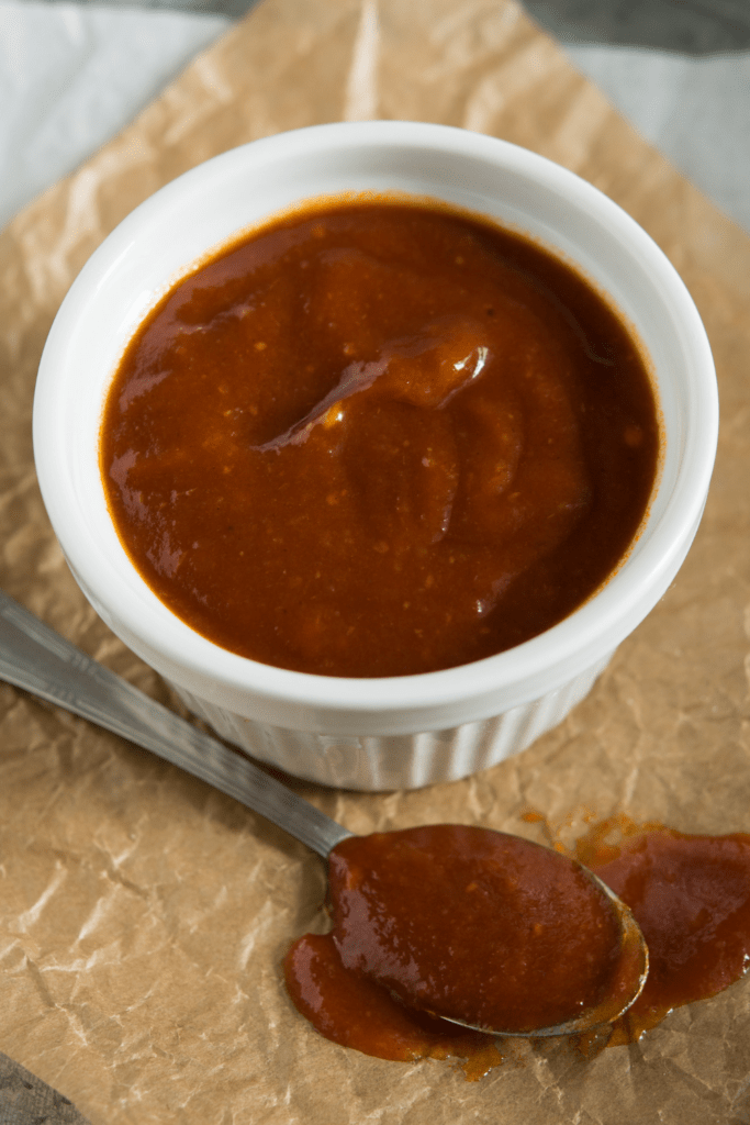 Heinz 57 Sauce in a small white container