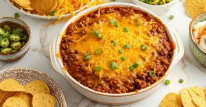 Cheesy and Meaty Homemade Hormel Chili Dip in a Bowl
