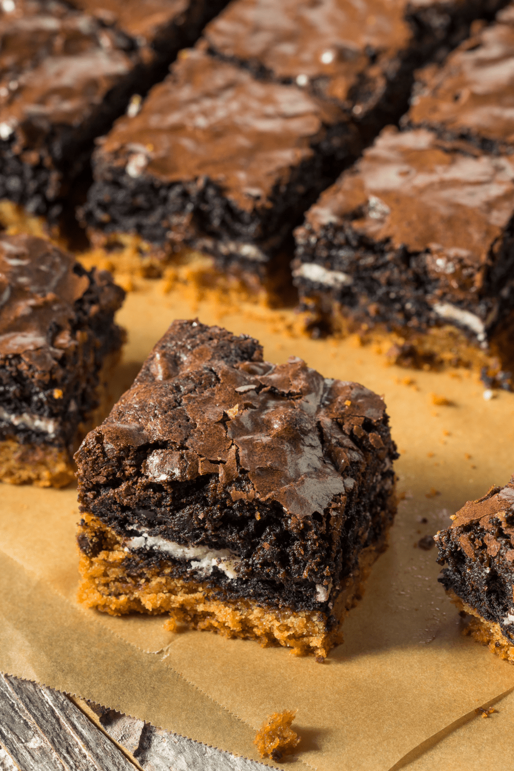 Slutty brownies with layers of cookie dough, Oreo filling and brownie. 