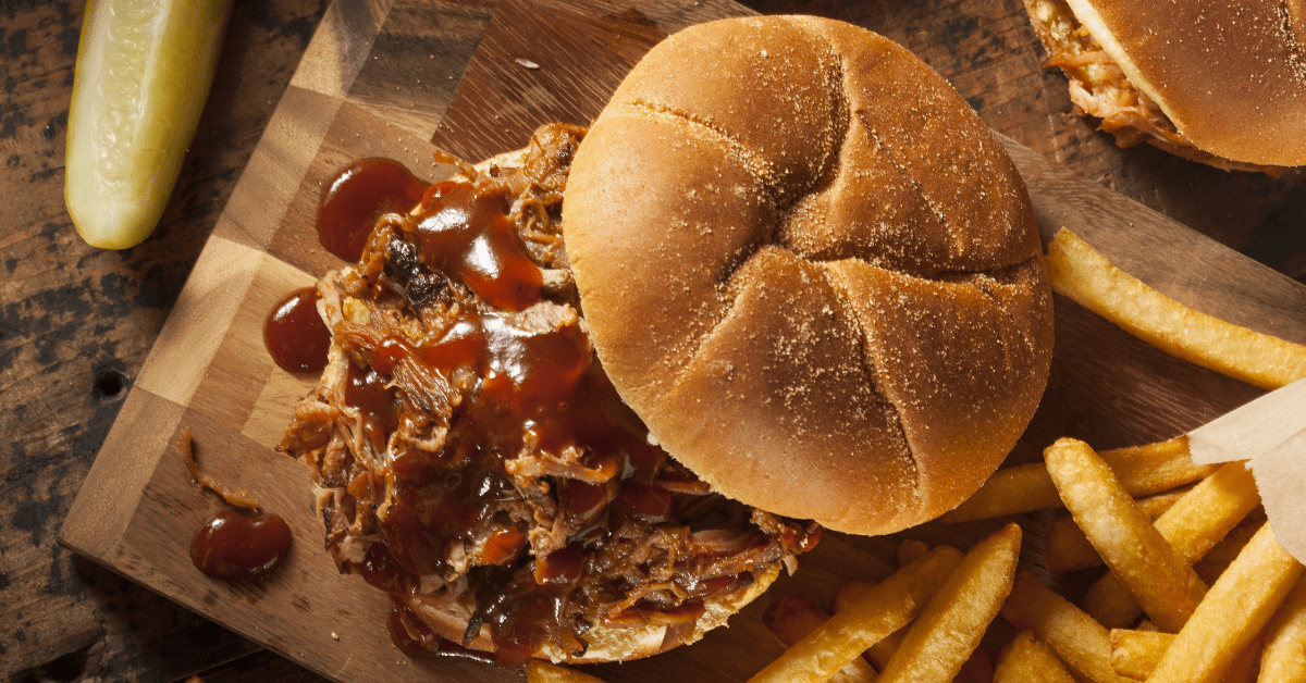 Homemade Pulled Pork Sandwich with Fries and BBQ Sauce