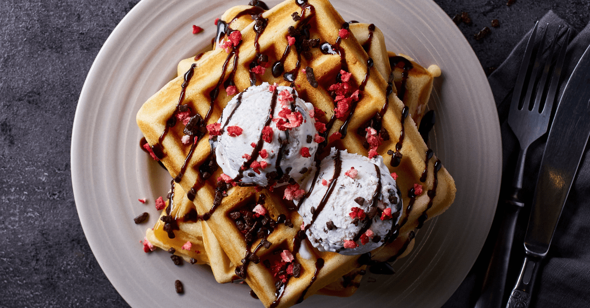 https://insanelygoodrecipes.com/wp-content/uploads/2021/02/Belgian-Waffles-with-Chocolate-Syrup-and-Ice-Cream.png