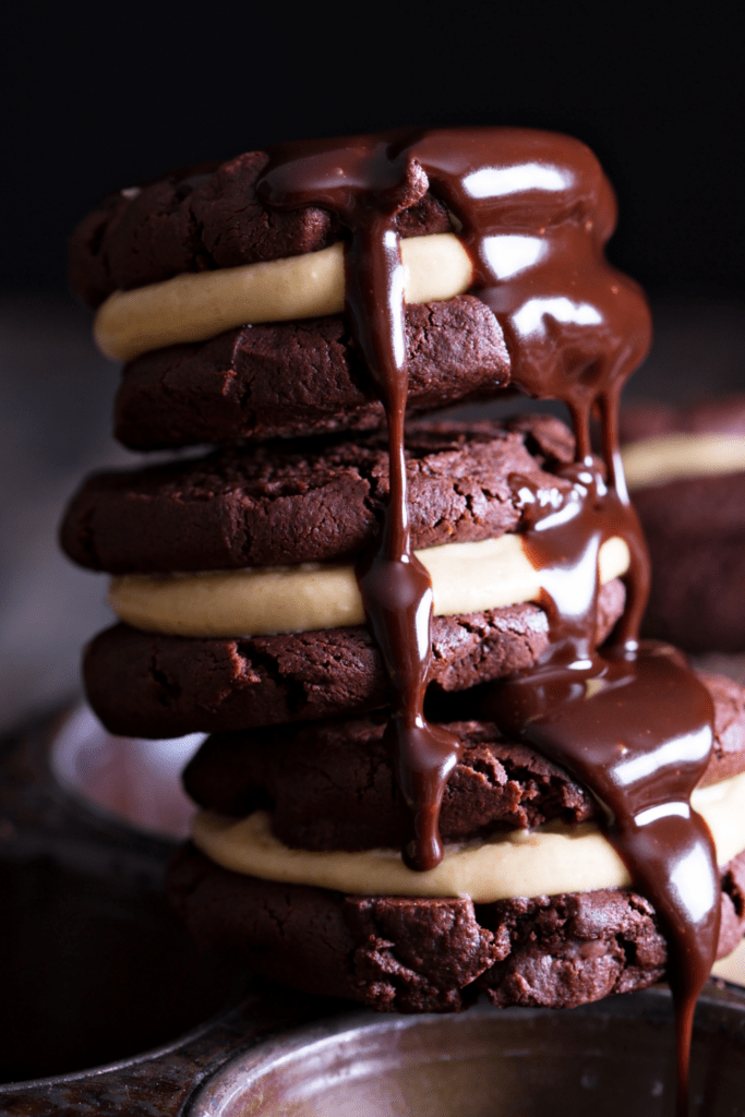 Whoopie pies drizzled with chocolate sauce