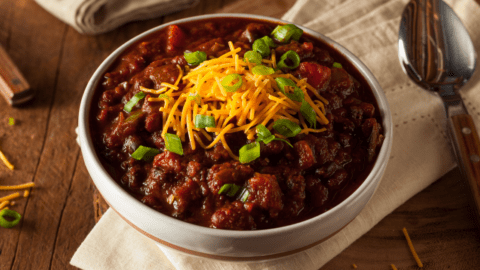 Homemade Bowl of Chili with Cheese and Chopped Onions