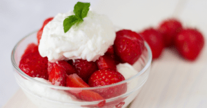 Homemade Strawberries with Whipped Cream in a Glass Bowl