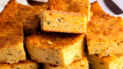 Mexican Cornbread Squares on a Cutting Board