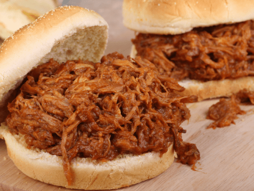 https://insanelygoodrecipes.com/wp-content/uploads/2021/02/Pulled-Pork-Coca-Cola-Sandwich-on-a-Cutting-Board-500x375.png