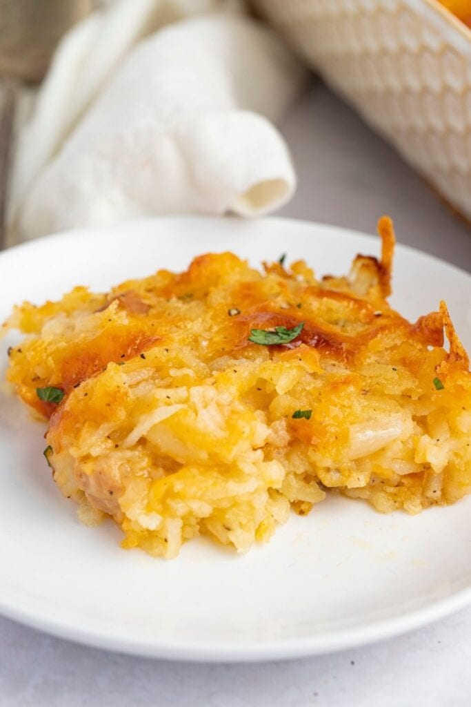 A Slice of Cheesy Hash Brown Casserole in a Plate