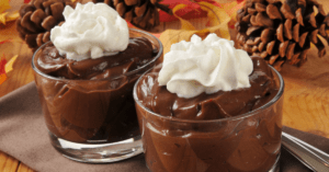 Chocolate Cornstarch Pudding with Whipped Cream in a Glass Bowl