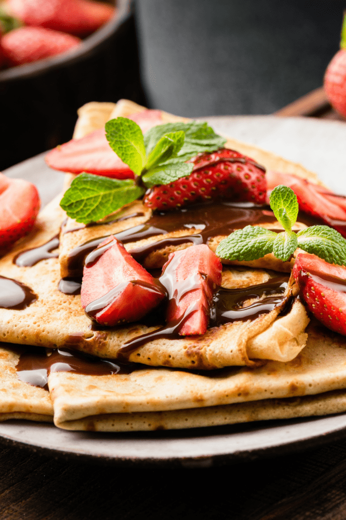 French Crepes with Strawberry and Chocolate Syrup