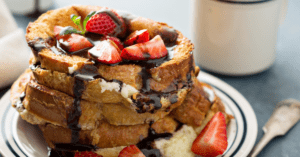 Homemade French Toast with Strawberries and Chocolate Syrup