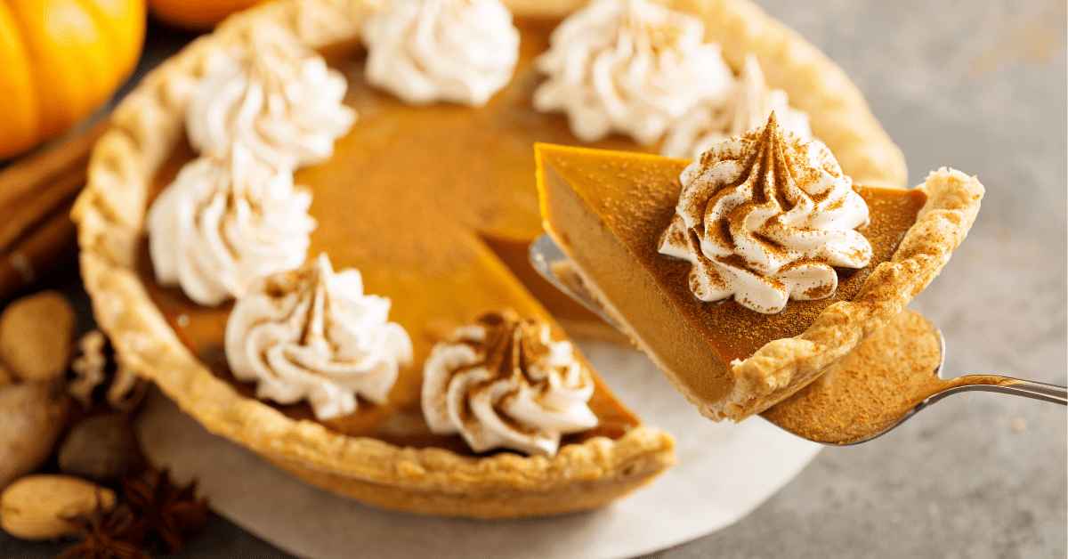 Homemade Pumpkin Pie with Whipped Cream and Cinnamon