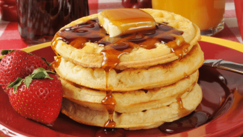 Homemade Buttermilk Waffles with Syrup and Strawberries