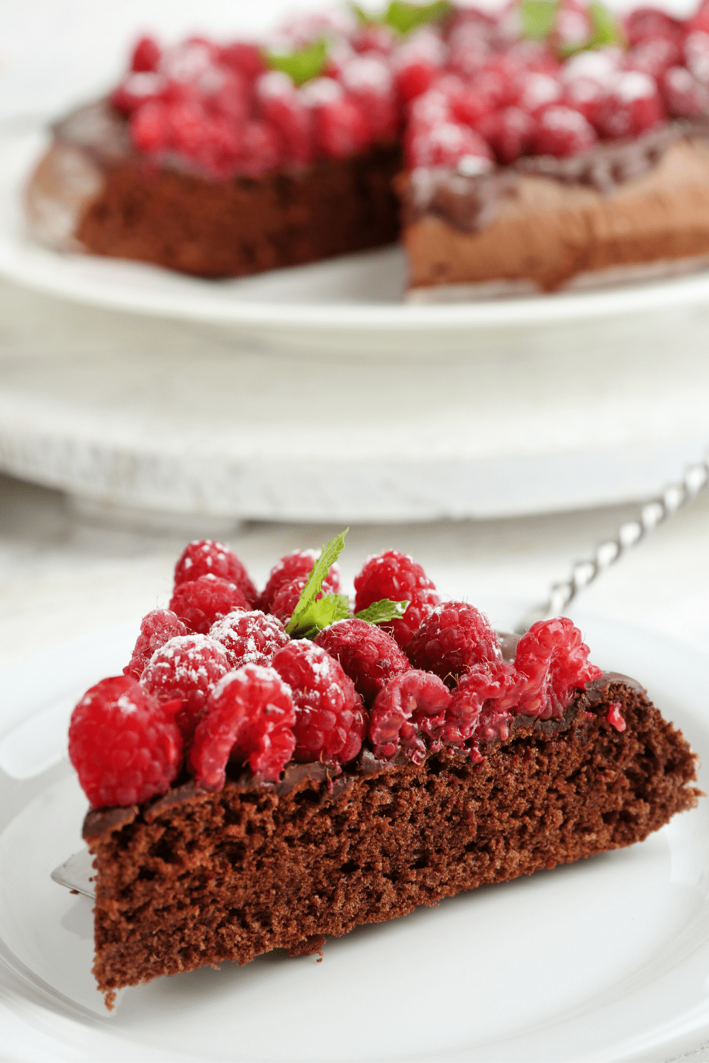 30 Easy Flourless Desserts Insanely Good   Piece Of Flourless Chocolate Cake With Raspberries 