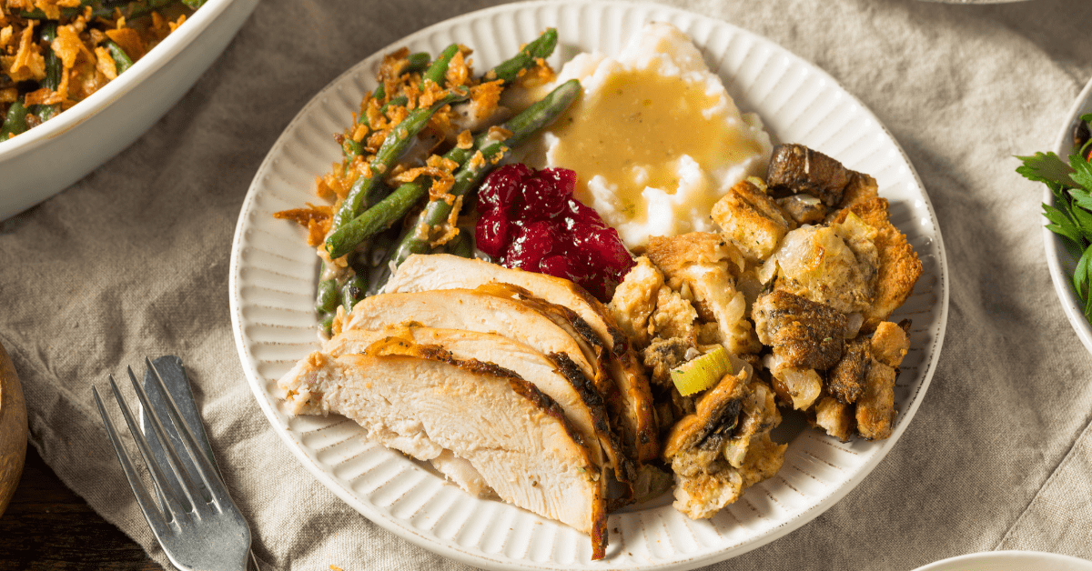 Thanksgiving Dinner with Turkey, Green Beans, Mashed Potatoes, Cranberry and Stuffing